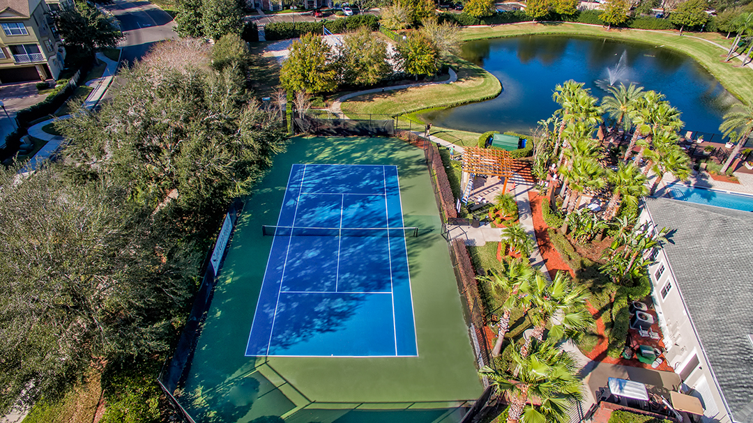 aerial view of tennis court and pond